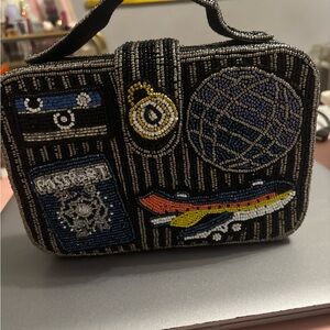 Sold 
Beaded Travel-Themed Clutch